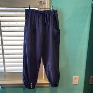 Women’s airy dark blue joggers with button decoration